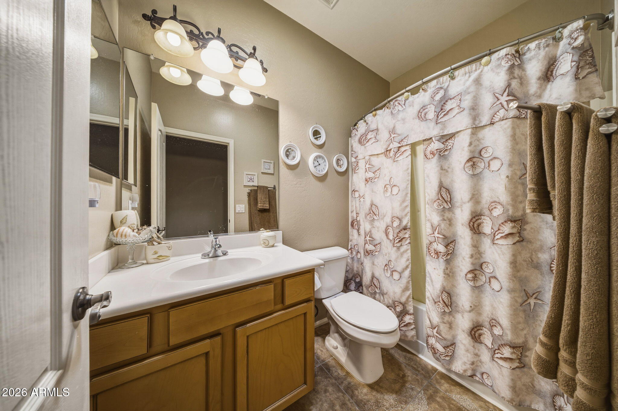11 West Cooper Canyon Road San Tan Valley, AZ 85143 - Photo 20 of 31 a bathroom with a sink a toilet and a mirror