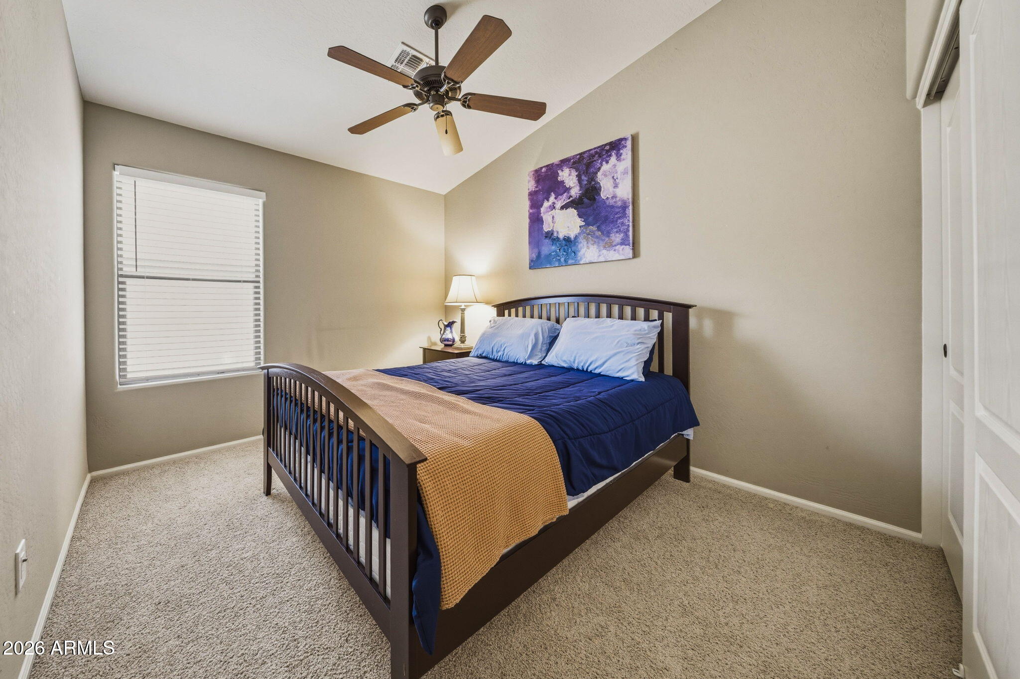 11 West Cooper Canyon Road San Tan Valley, AZ 85143 - Photo 23 of 31 a bedroom with a bed and a chandelier