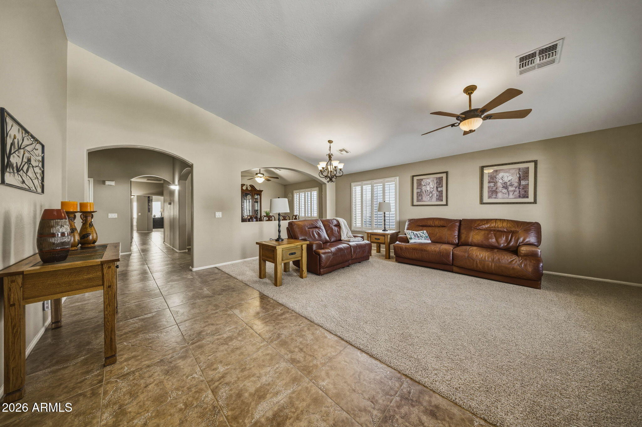 11 West Cooper Canyon Road San Tan Valley, AZ 85143 - Photo 4 of 31 a living room with furniture and a chandelier