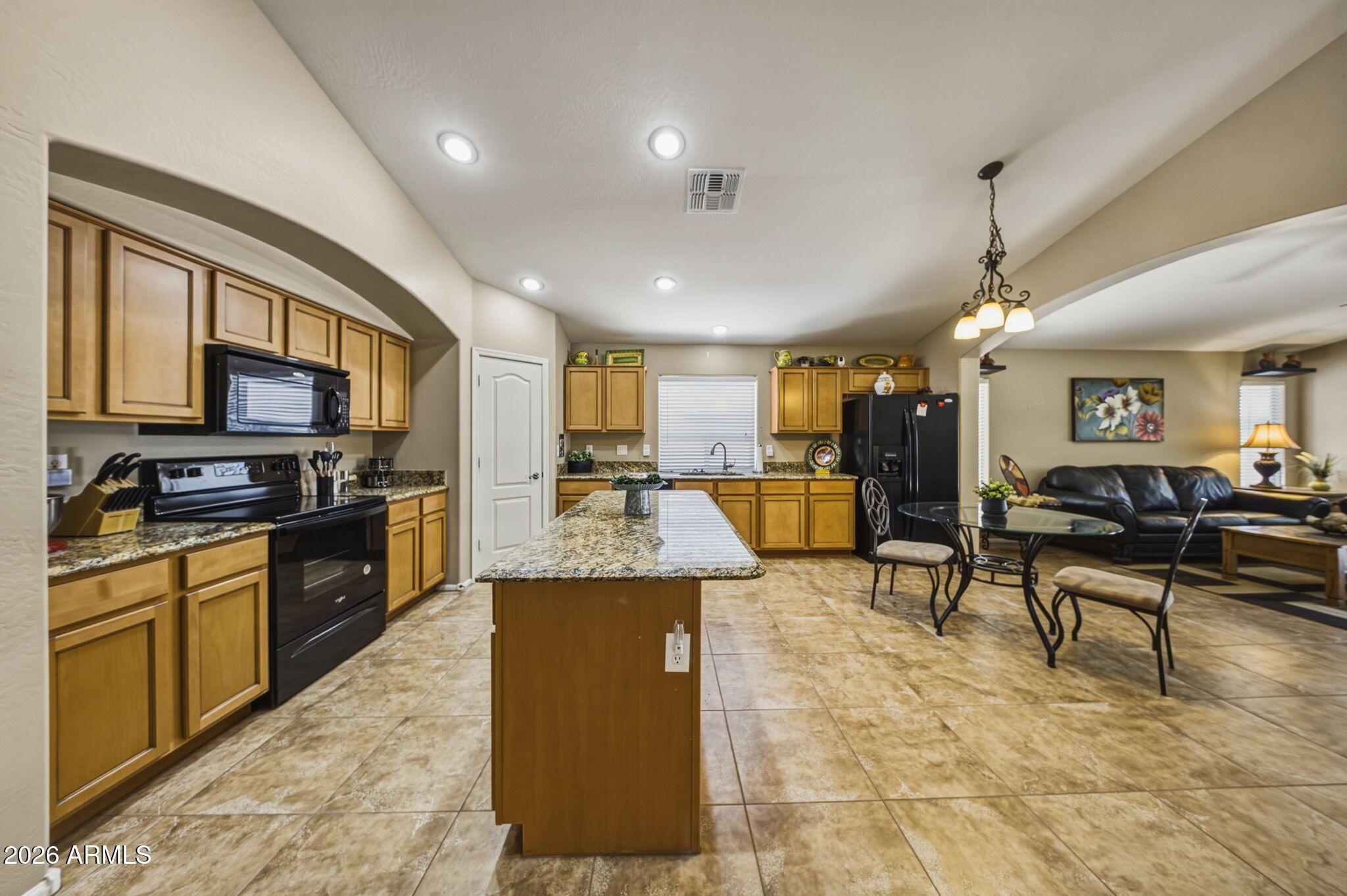 11 West Cooper Canyon Road San Tan Valley, AZ 85143 - Photo 7 of 31 a living room with stainless steel appliances kitchen island granite countertop furniture and a kitchen view