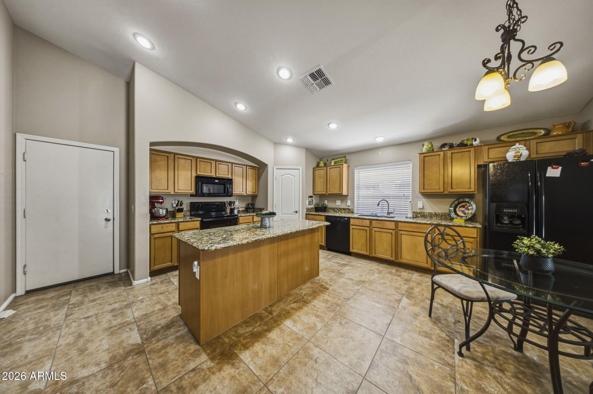 11 West Cooper Canyon Road San Tan Valley, AZ 85143 - Photo 8 of 31 a large kitchen with a table and chairs
