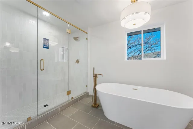 a bathroom with a bathtub and a shower