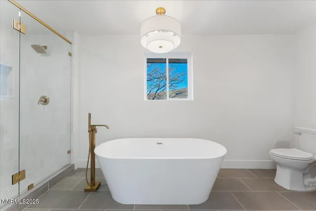 a white bath tub sitting in a bathroom