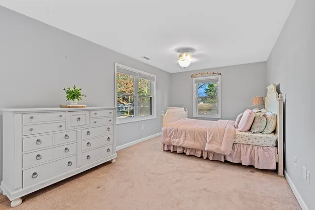 a bed room with a bed and a window