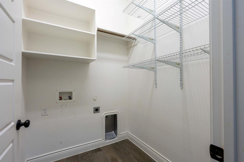 1501 Calcot Lane Forney, TX 75126 - Photo 25 of 34 Dedicated utility space featuring wood-finish flooring, white baseboards, and bright white walls