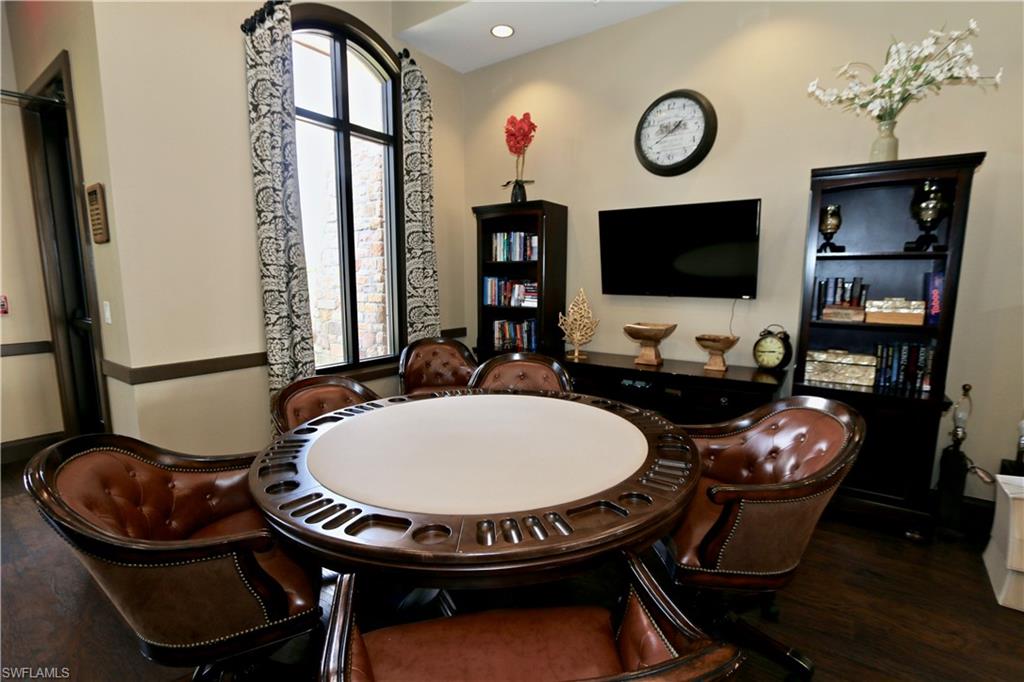 8437 Rosa Court Naples, FL 34114 - Photo 26 of 32 a view of a dining room with furniture