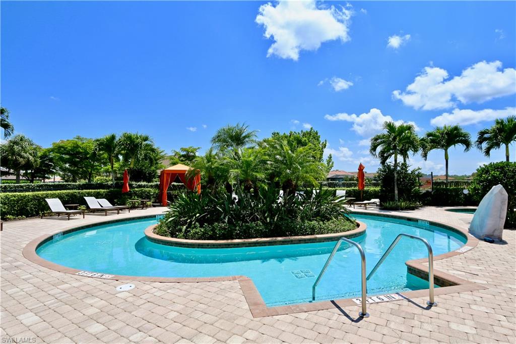 8437 Rosa Court Naples, FL 34114 - Photo 29 of 32 a view of a swimming pool with a patio