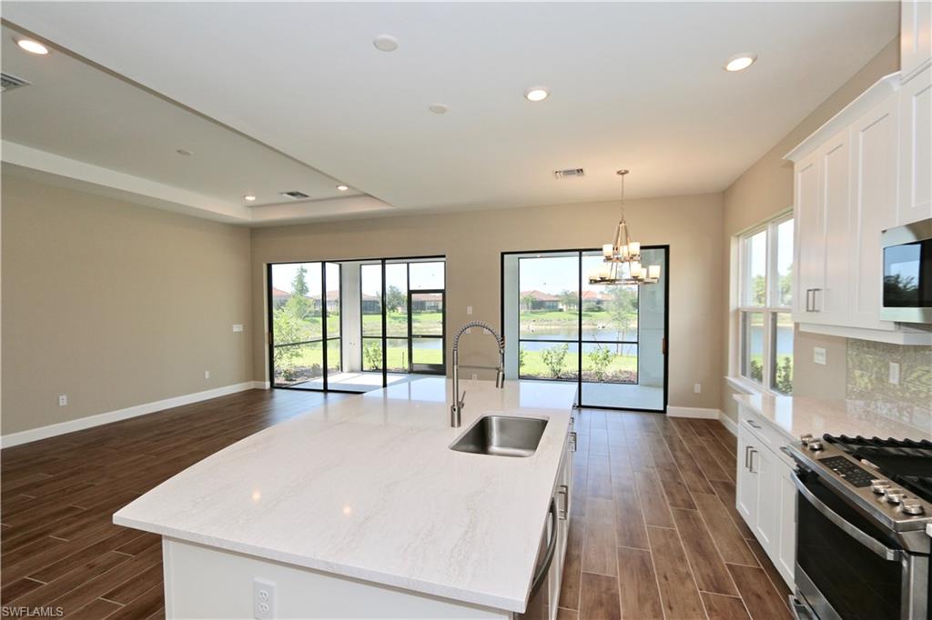 8437 Rosa Court Naples, FL 34114 - Photo 5 of 32 a large white room with a large window