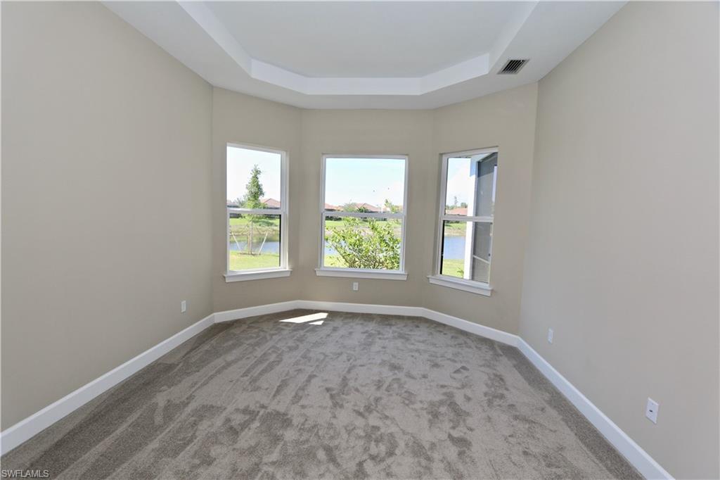 8437 Rosa Court Naples, FL 34114 - Photo 9 of 32 an empty room with a window