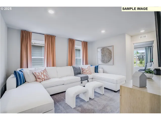 a living room with furniture and a large mirror