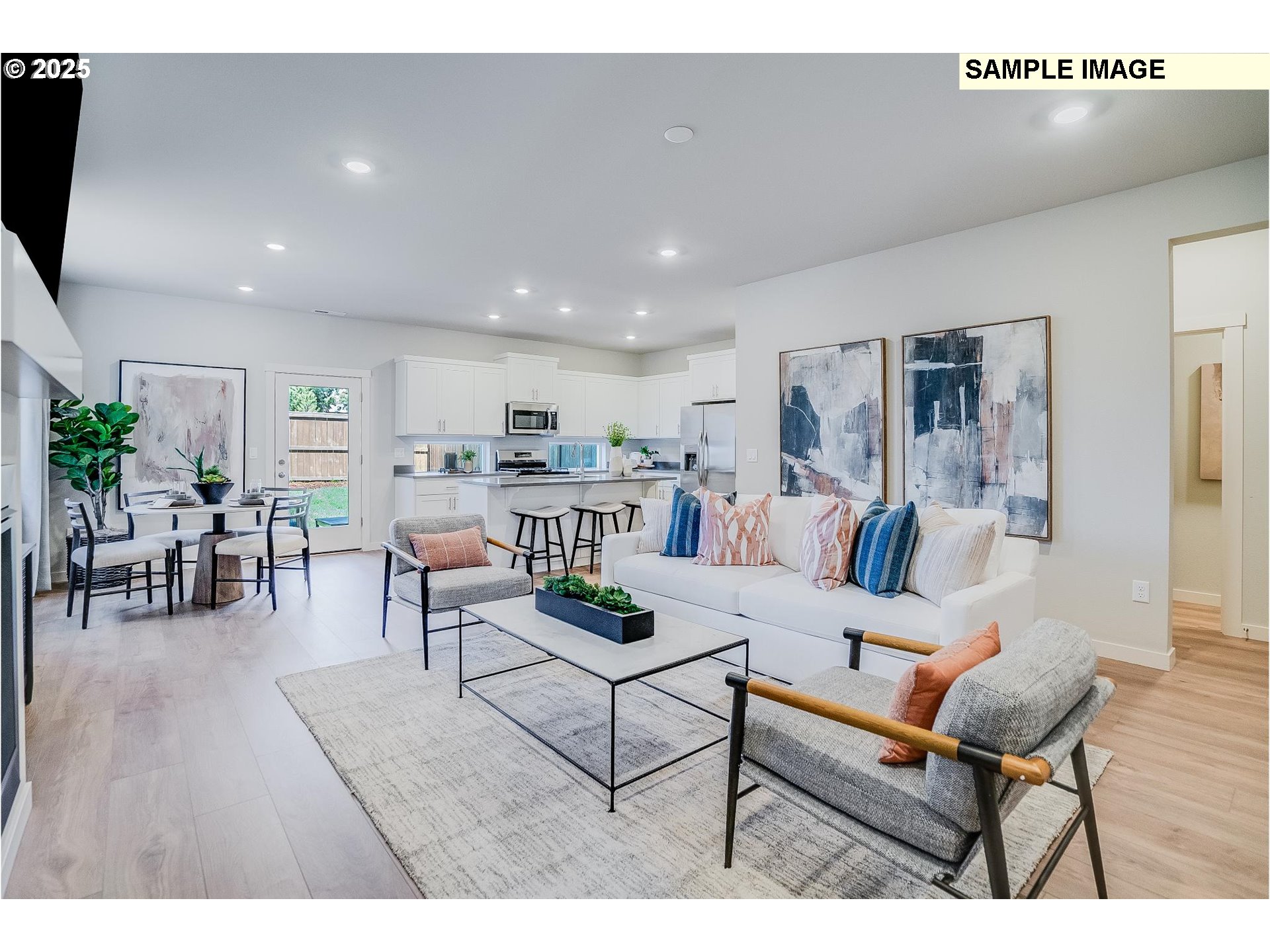 23809 Southwest Black Tortoise Terrace Tualatin, OR 97062 - Photo 3 of 26 a living room with furniture and kitchen view