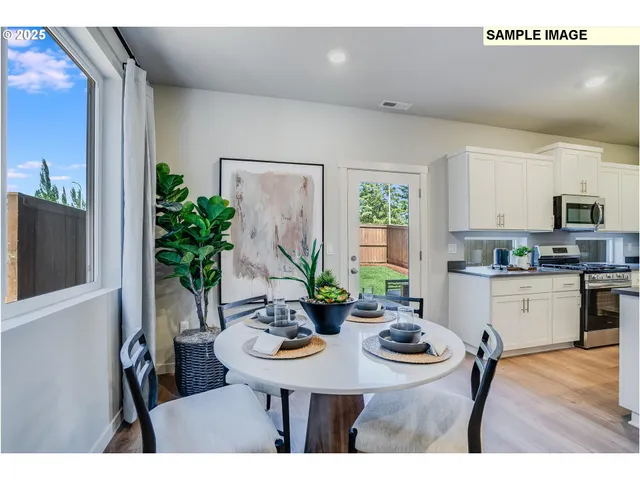 a kitchen with a table and chairs in it