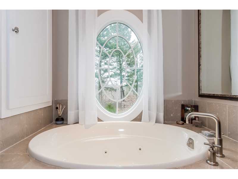 16 Locust Hill Road Darien, CT 06820 - Photo 15 of 25 a white bath tub sitting next to a window