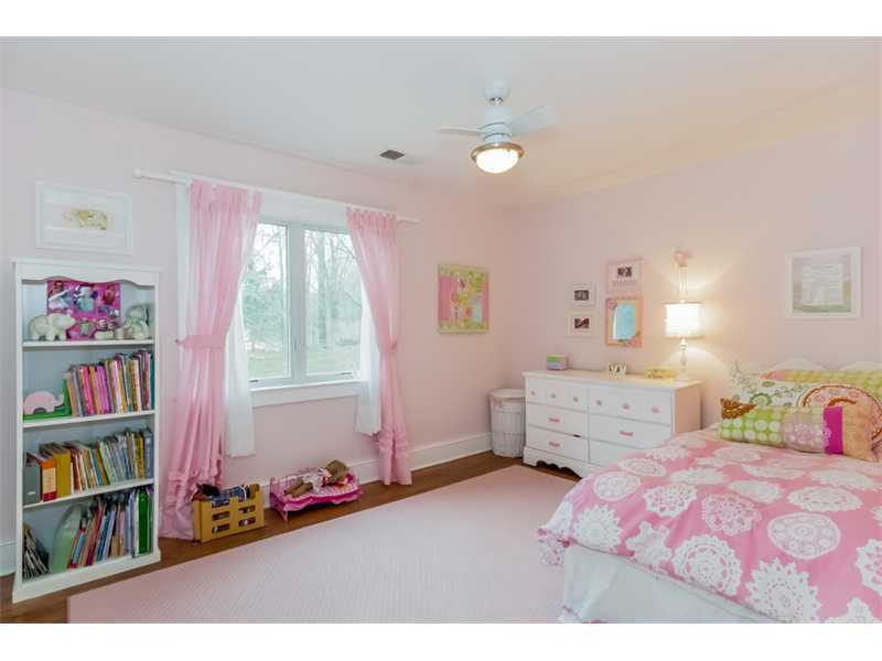 16 Locust Hill Road Darien, CT 06820 - Photo 16 of 25 a bedroom with furniture and window