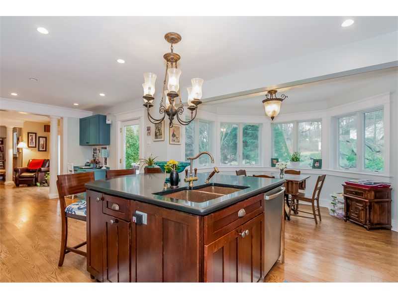 16 Locust Hill Road Darien, CT 06820 - Photo 7 of 25 a kitchen with a table and chairs