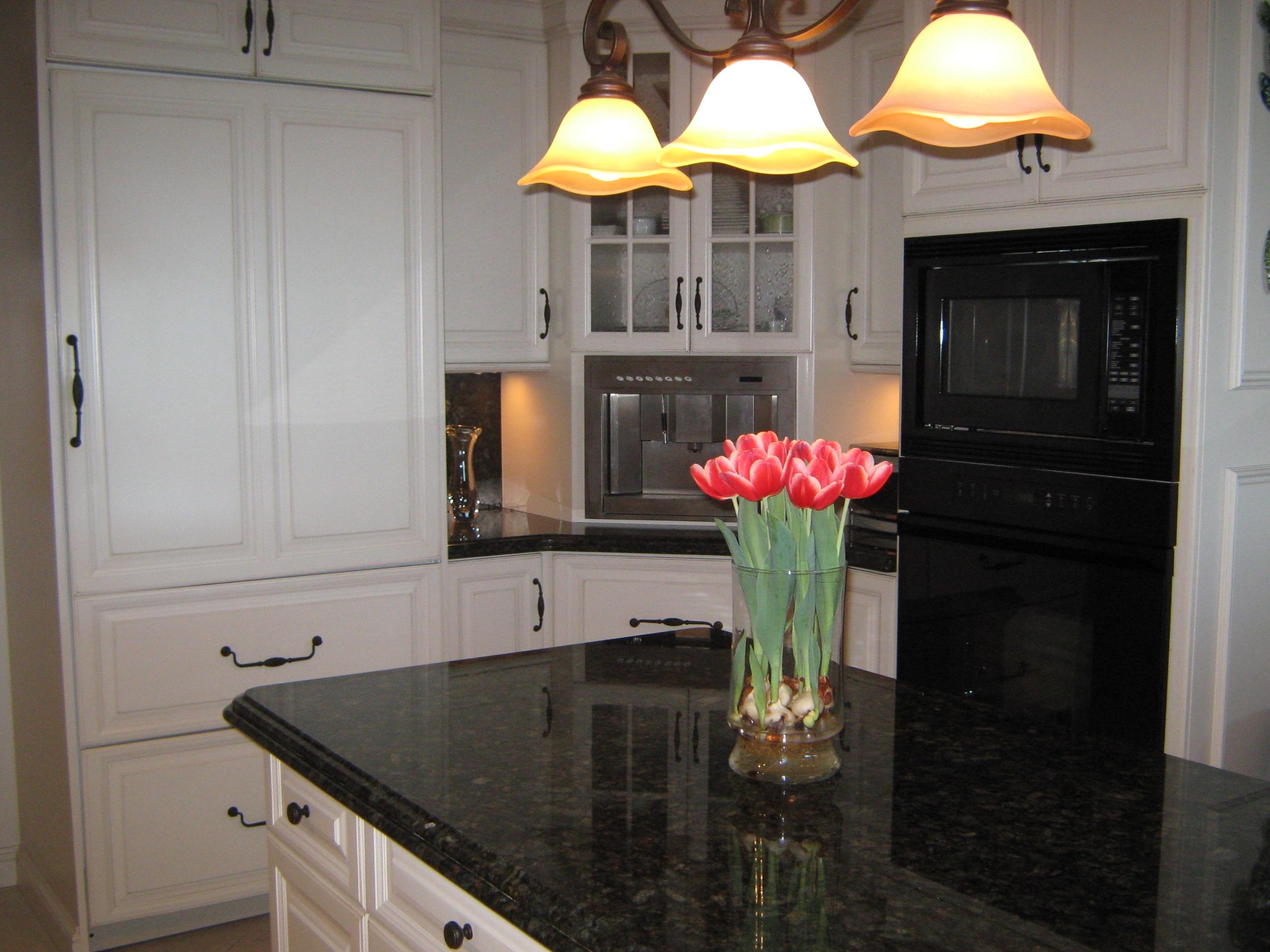 19670 South Beach Road, Unit PHB4 Jupiter, FL 33469 - Photo 12 of 35 a kitchen with a sink and cabinets