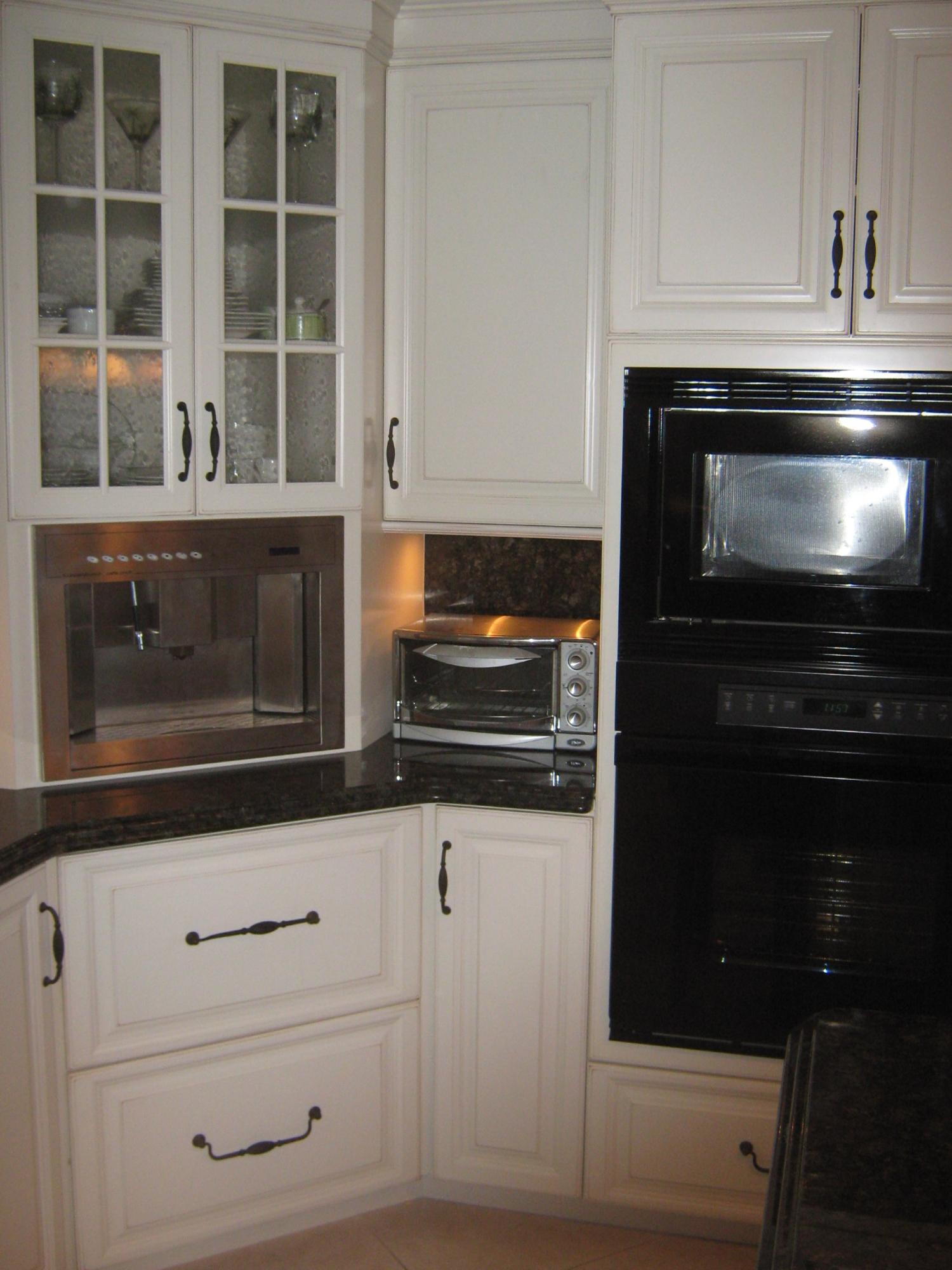 19670 South Beach Road, Unit PHB4 Jupiter, FL 33469 - Photo 13 of 35 a kitchen with granite countertop white cabinets and appliances