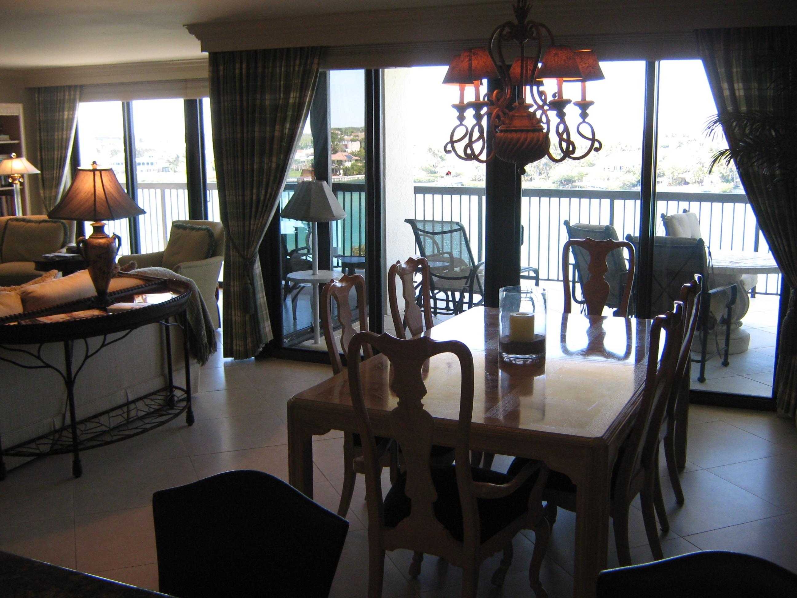 19670 South Beach Road, Unit PHB4 Jupiter, FL 33469 - Photo 16 of 35 a view of a dining room with furniture window and wooden floor