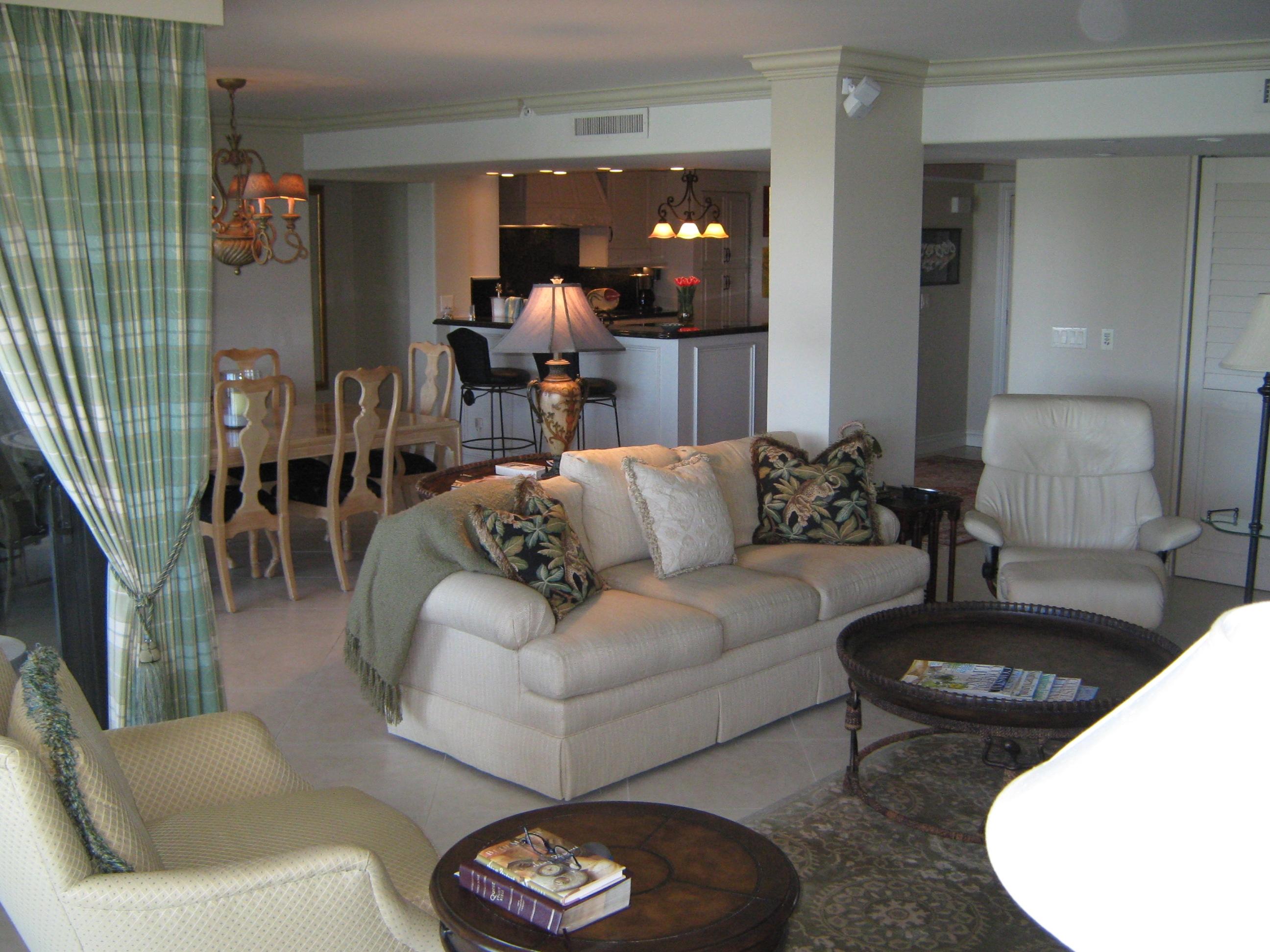 19670 South Beach Road, Unit PHB4 Jupiter, FL 33469 - Photo 17 of 35 a living room with furniture and a wooden floor