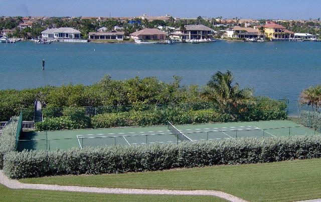 19670 South Beach Road, Unit PHB4 Jupiter, FL 33469 - Photo 2 of 35 an aerial view of a house with a yard and lake view