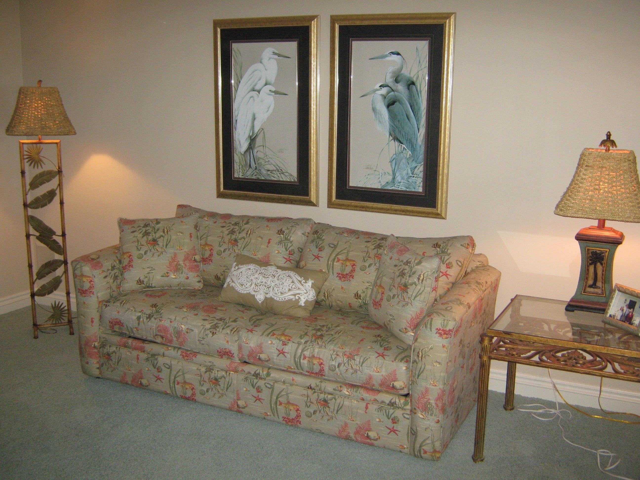 19670 South Beach Road, Unit PHB4 Jupiter, FL 33469 - Photo 21 of 35 a living room with furniture and a painting on the wall