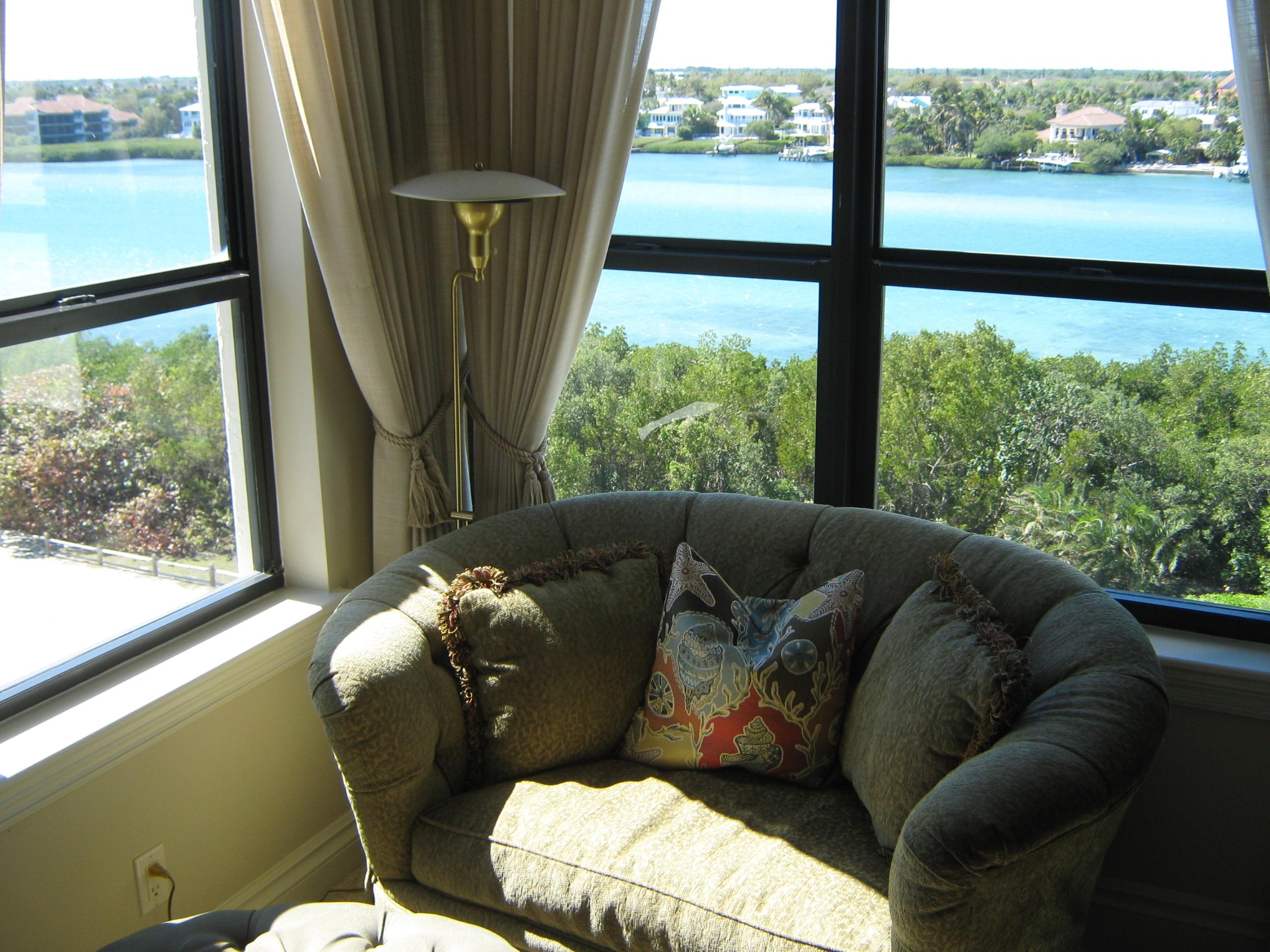 19670 South Beach Road, Unit PHB4 Jupiter, FL 33469 - Photo 24 of 35 a living room with furniture and a large window