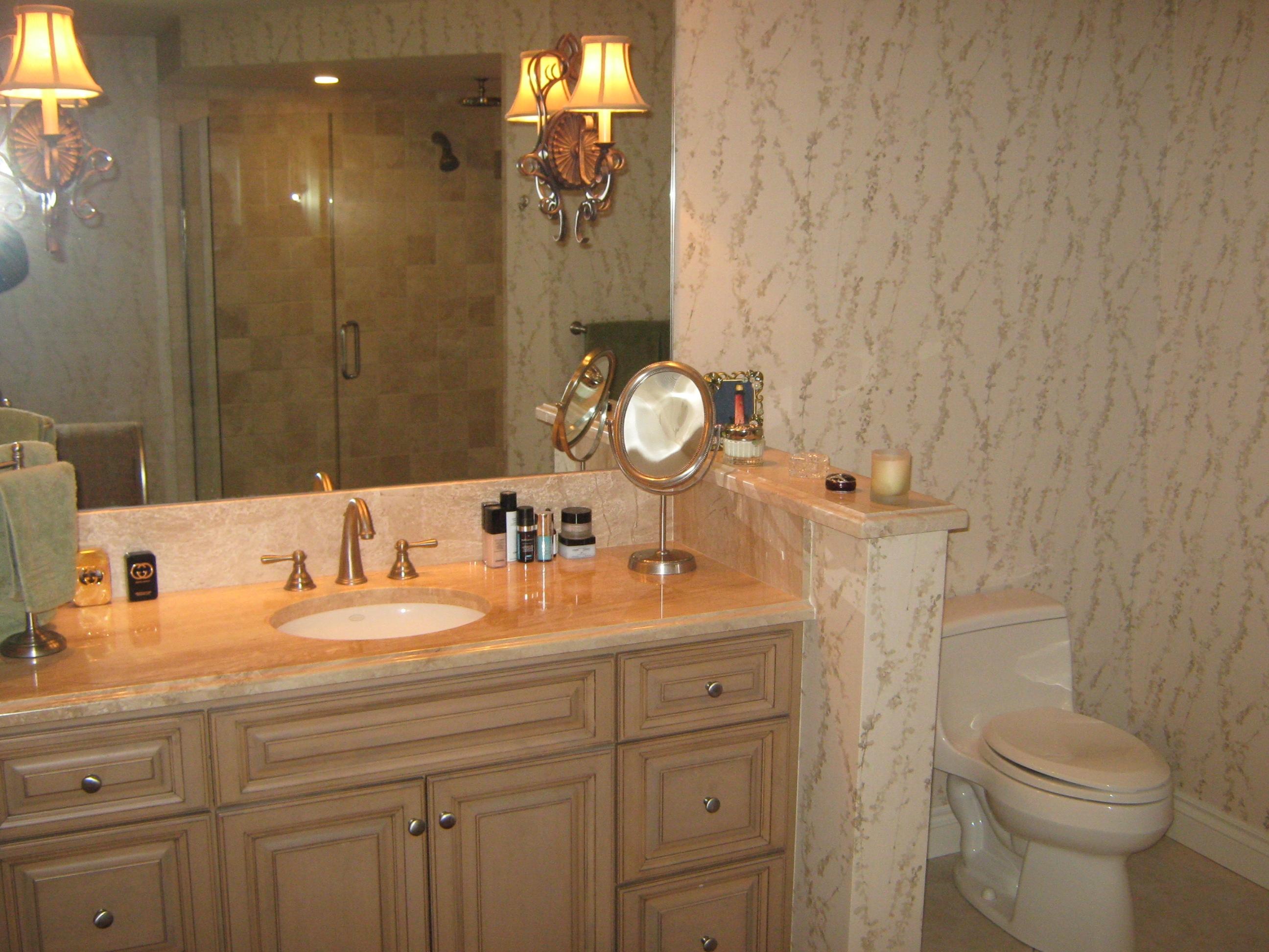 19670 South Beach Road, Unit PHB4 Jupiter, FL 33469 - Photo 26 of 35 a bathroom with a toilet sink and mirror