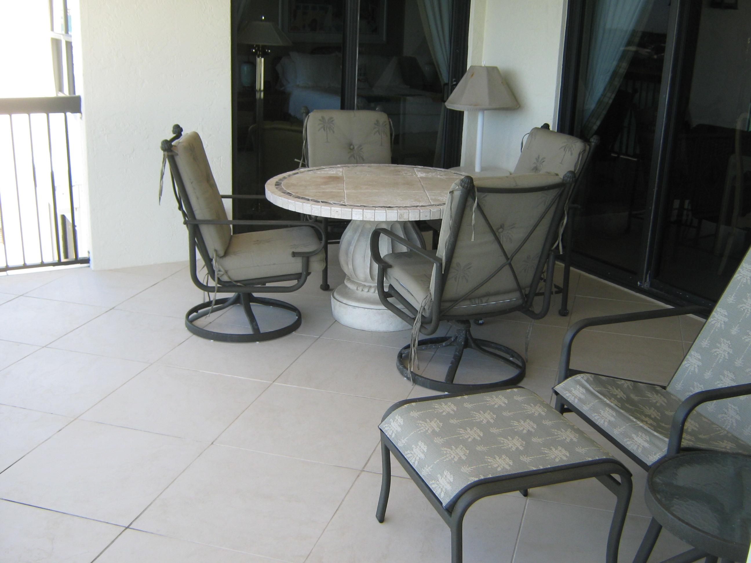 19670 South Beach Road, Unit PHB4 Jupiter, FL 33469 - Photo 30 of 35 a view of a dining room with furniture and chandelier