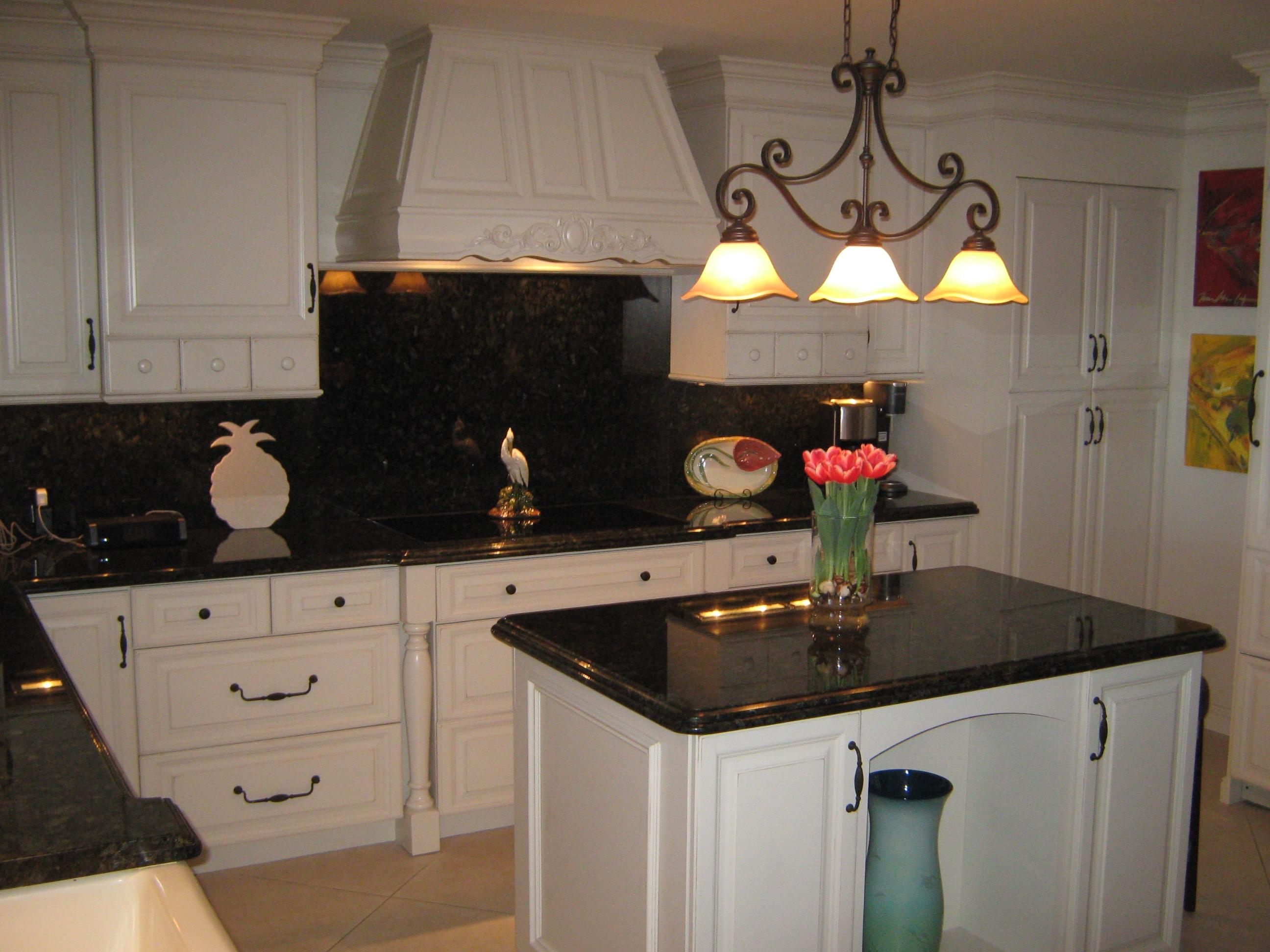 19670 South Beach Road, Unit PHB4 Jupiter, FL 33469 - Photo 10 of 35 a kitchen with a sink a stove and a microwave