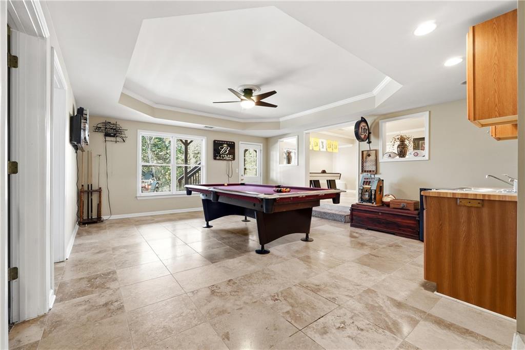 585 Tilbury Drive Suwanee, GA 30024 - Photo 30 of 46 a living room with furniture and a large window