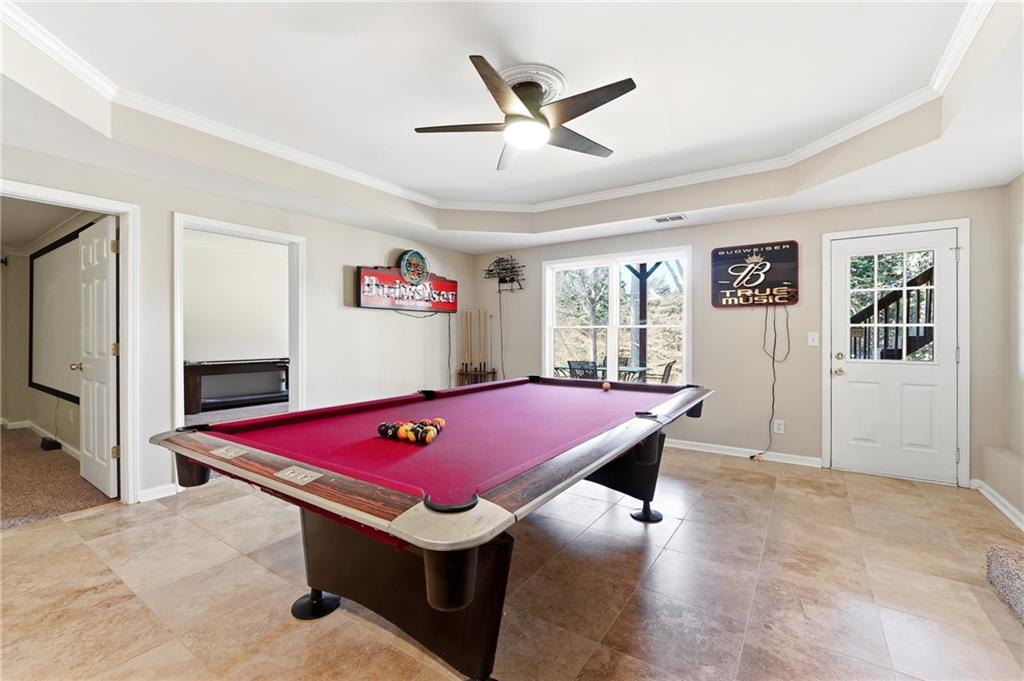 585 Tilbury Drive Suwanee, GA 30024 - Photo 31 of 46 a room with pool table and windows