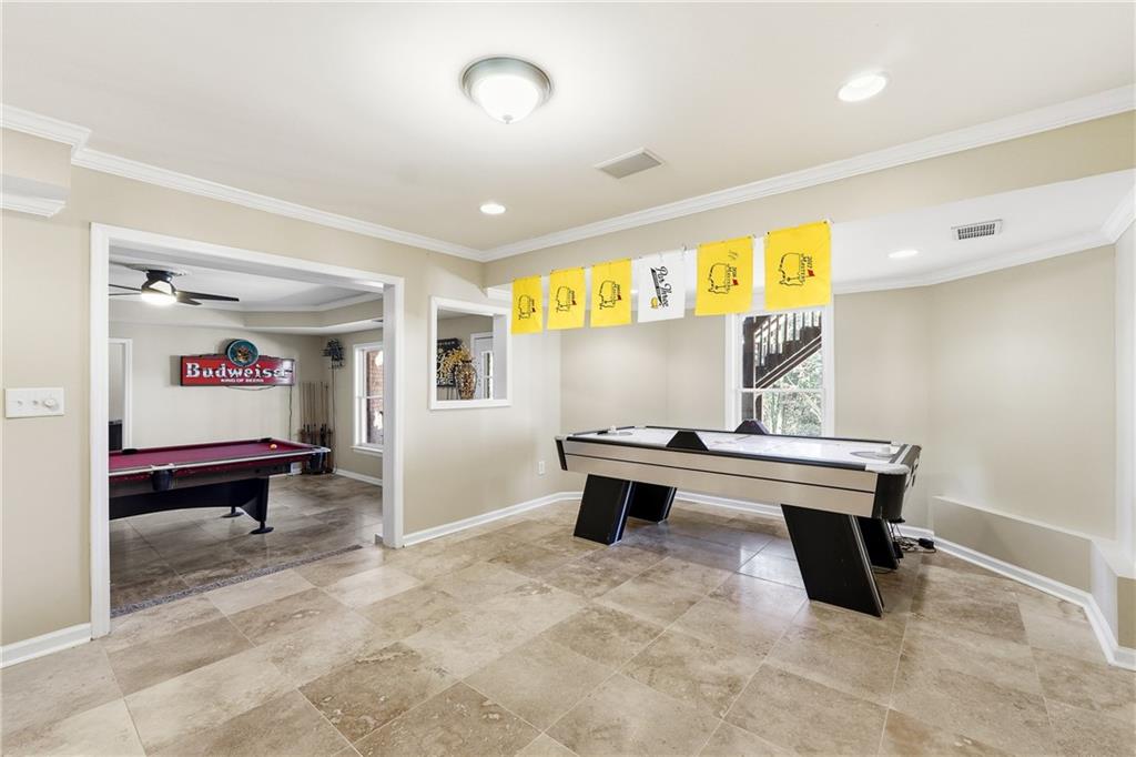 585 Tilbury Drive Suwanee, GA 30024 - Photo 35 of 46 a view of game room with windows
