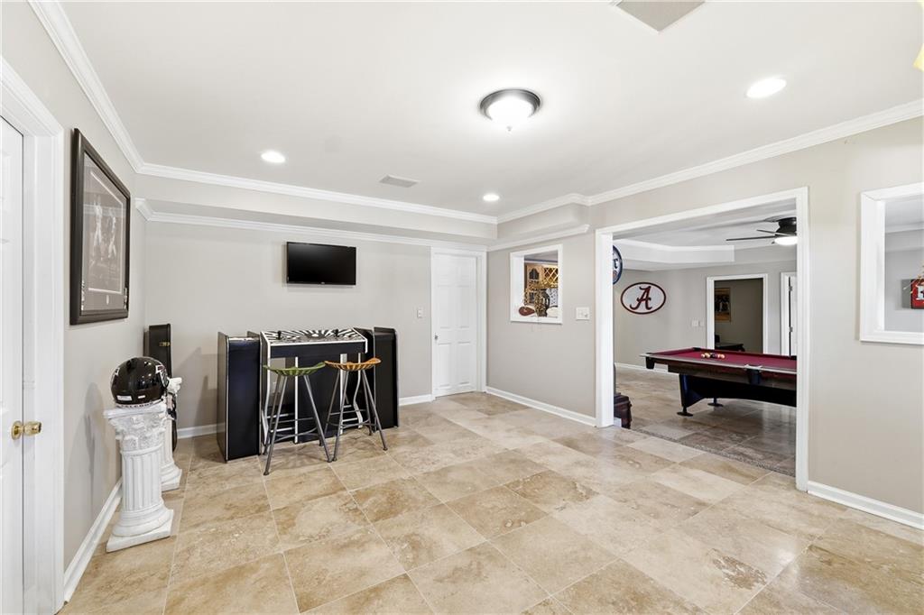 585 Tilbury Drive Suwanee, GA 30024 - Photo 36 of 46 a view of a livingroom with furniture and a flat screen tv