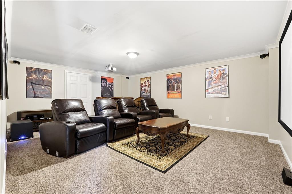 585 Tilbury Drive Suwanee, GA 30024 - Photo 37 of 46 a living room with furniture rug and window