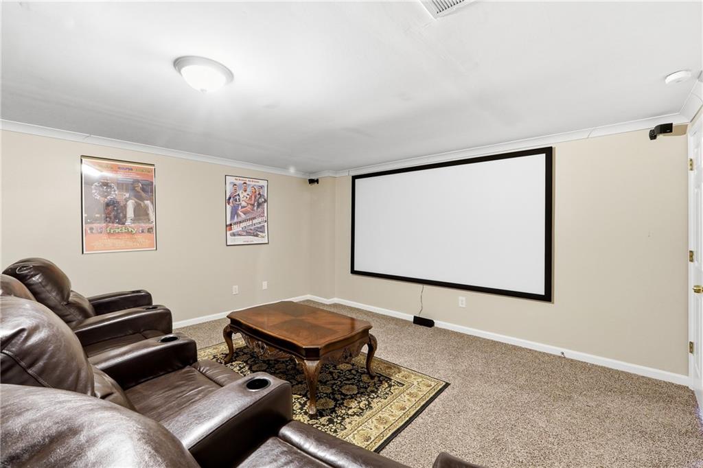 585 Tilbury Drive Suwanee, GA 30024 - Photo 38 of 46 a living room with couch