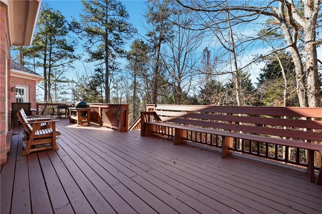 585 Tilbury Drive Suwanee, GA 30024 - Photo 40 of 46 a view of a roof deck with wooden floor and fence