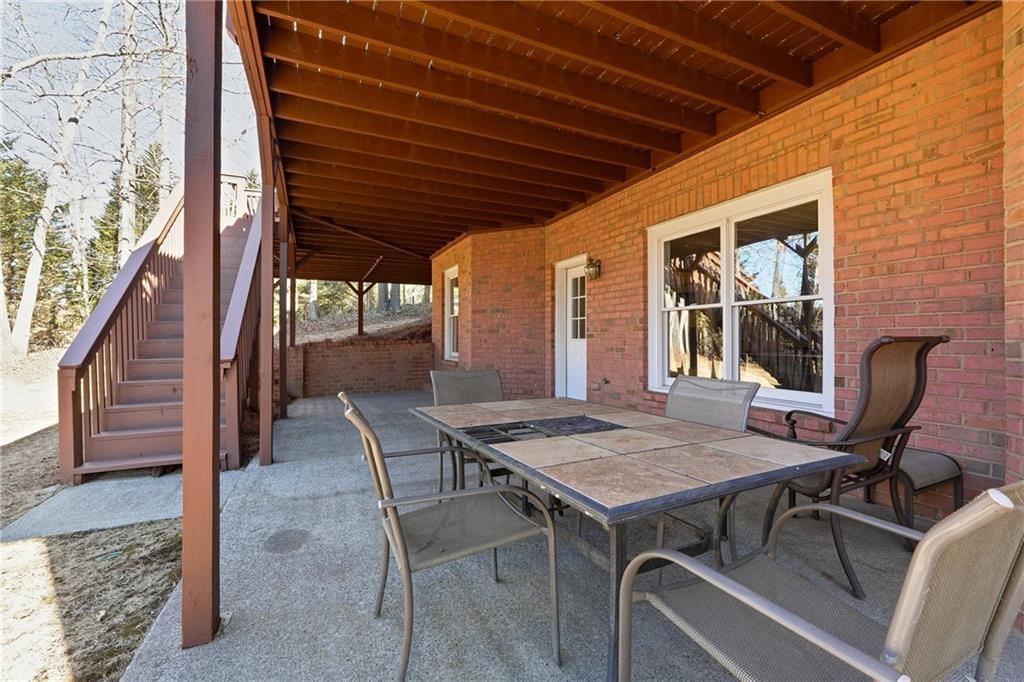 585 Tilbury Drive Suwanee, GA 30024 - Photo 42 of 46 a view of an outdoor space with seating area