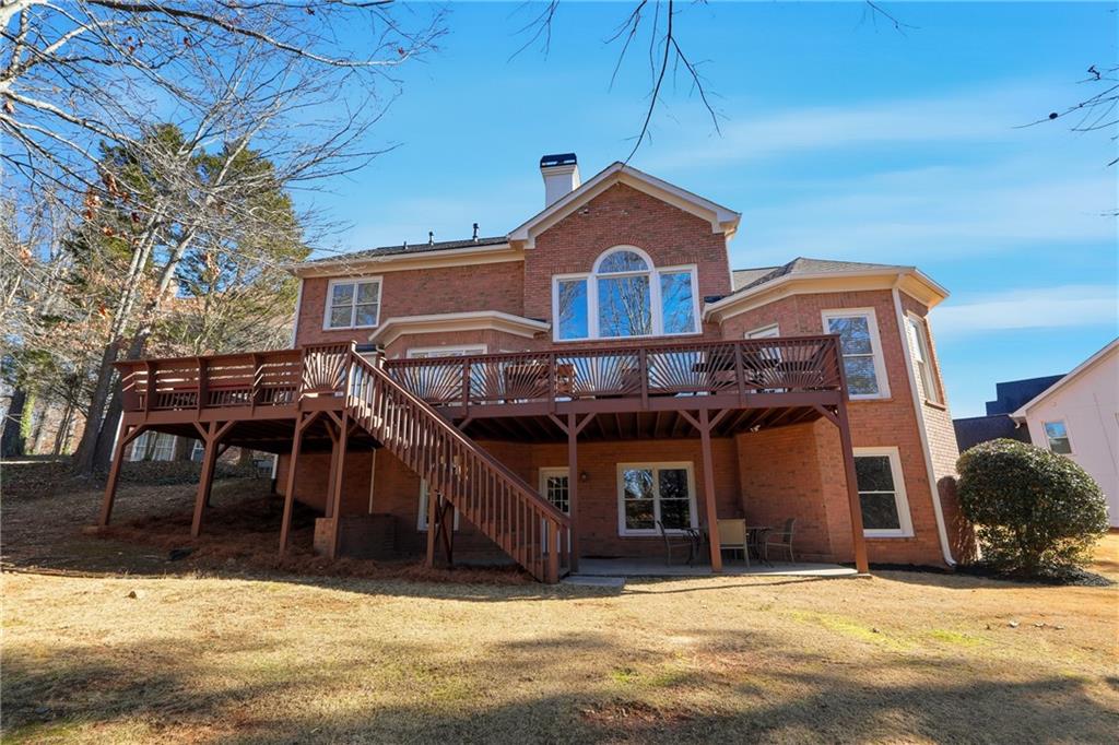 585 Tilbury Drive Suwanee, GA 30024 - Photo 43 of 46 a front view of a house with a yard