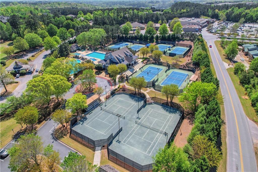 585 Tilbury Drive Suwanee, GA 30024 - Photo 45 of 46 an aerial view of a house with a lake view