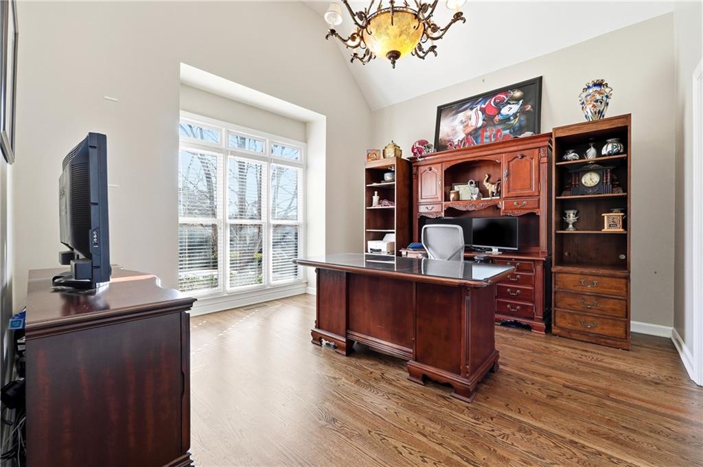 585 Tilbury Drive Suwanee, GA 30024 - Photo 5 of 46 a view of a workspace with furniture and a window