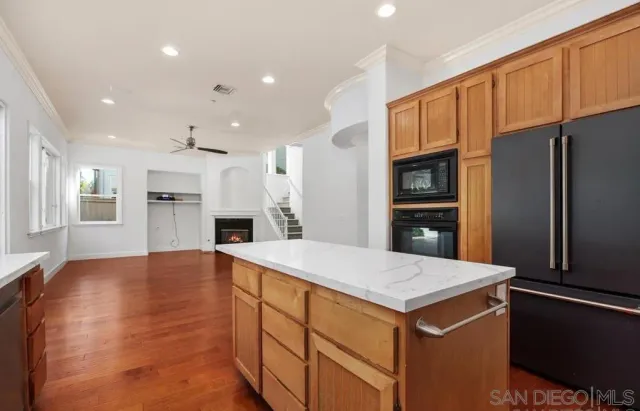 a kitchen with a refrigerator and a sink