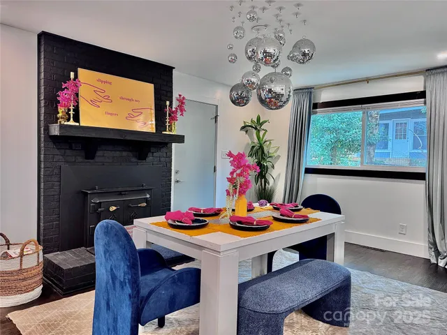 a view of a dining room with furniture and window