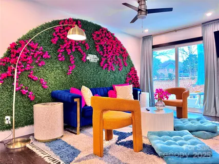 a room with flowers and a table