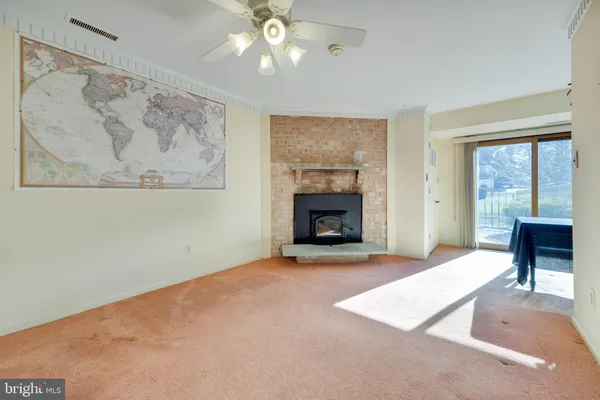 wooden floor fireplace and windows in a room