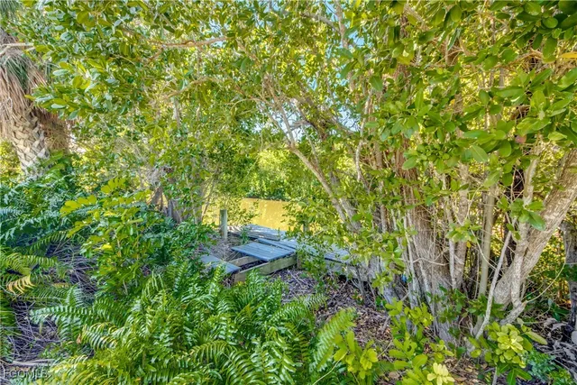 a view of a back yard from a backyard of a house