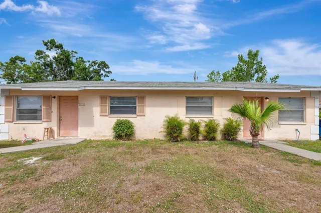 front view of a house with a yard