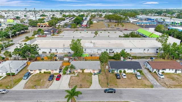 an aerial view of residential houses with outdoor space