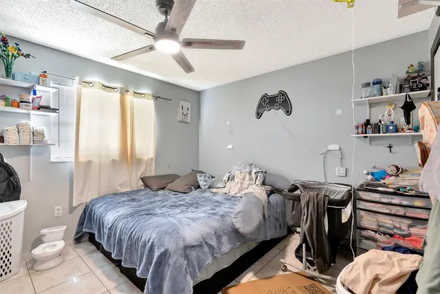 a bedroom with a bed and dresser