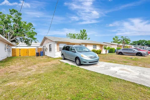 a house view with a backyard space