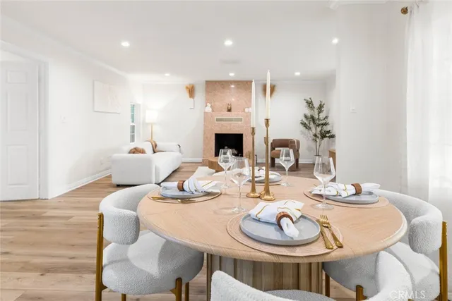 a dining room with furniture and a fireplace